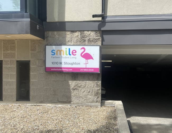 Smile Building Student Living Sign