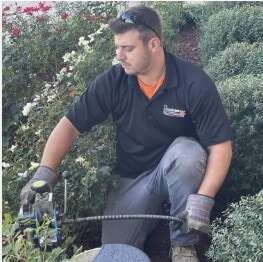 technician-cleaning-drain