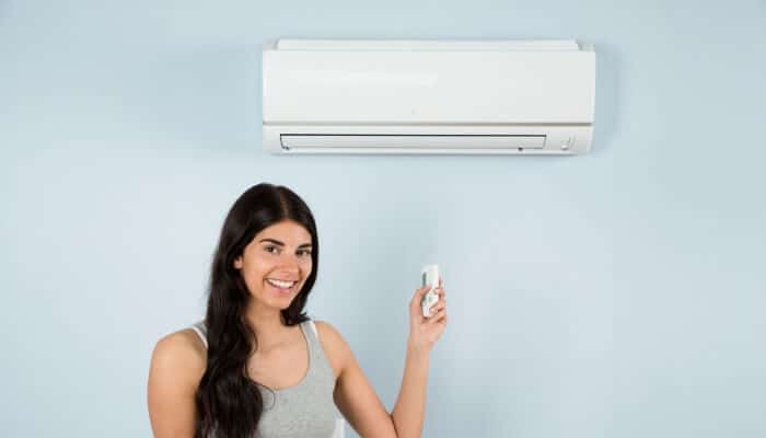 woman with ductless mini split 1 woman with ductless mini split 1