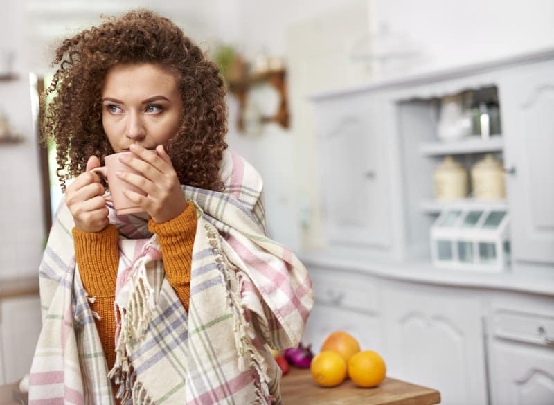 wrapped in blanket drinking coffee min